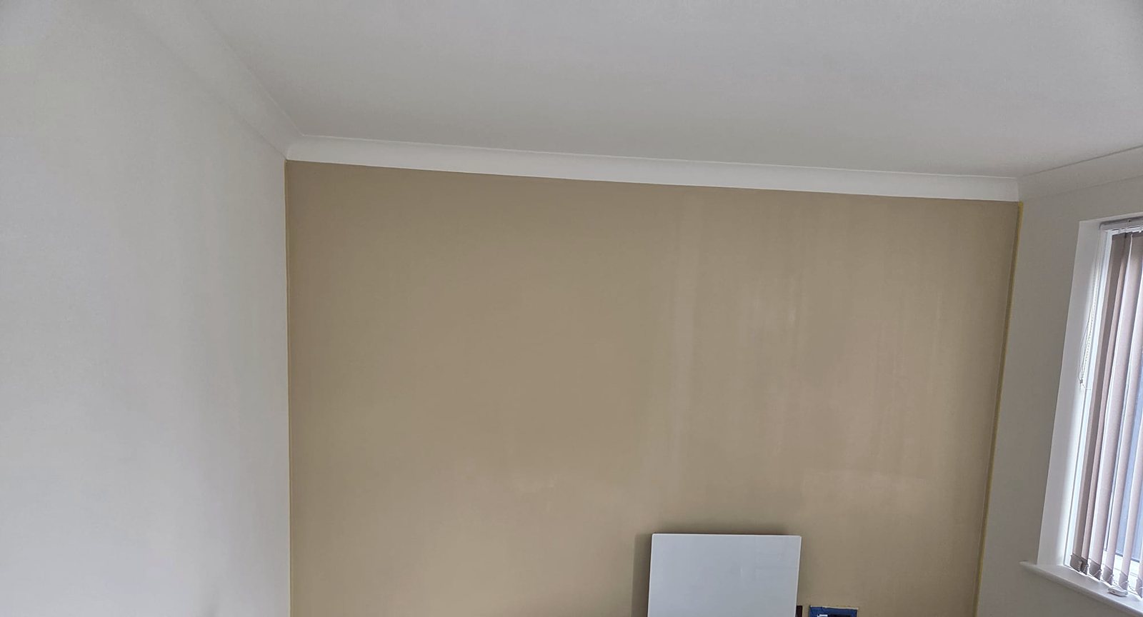 Warm beige feature wall, painted by Zakro