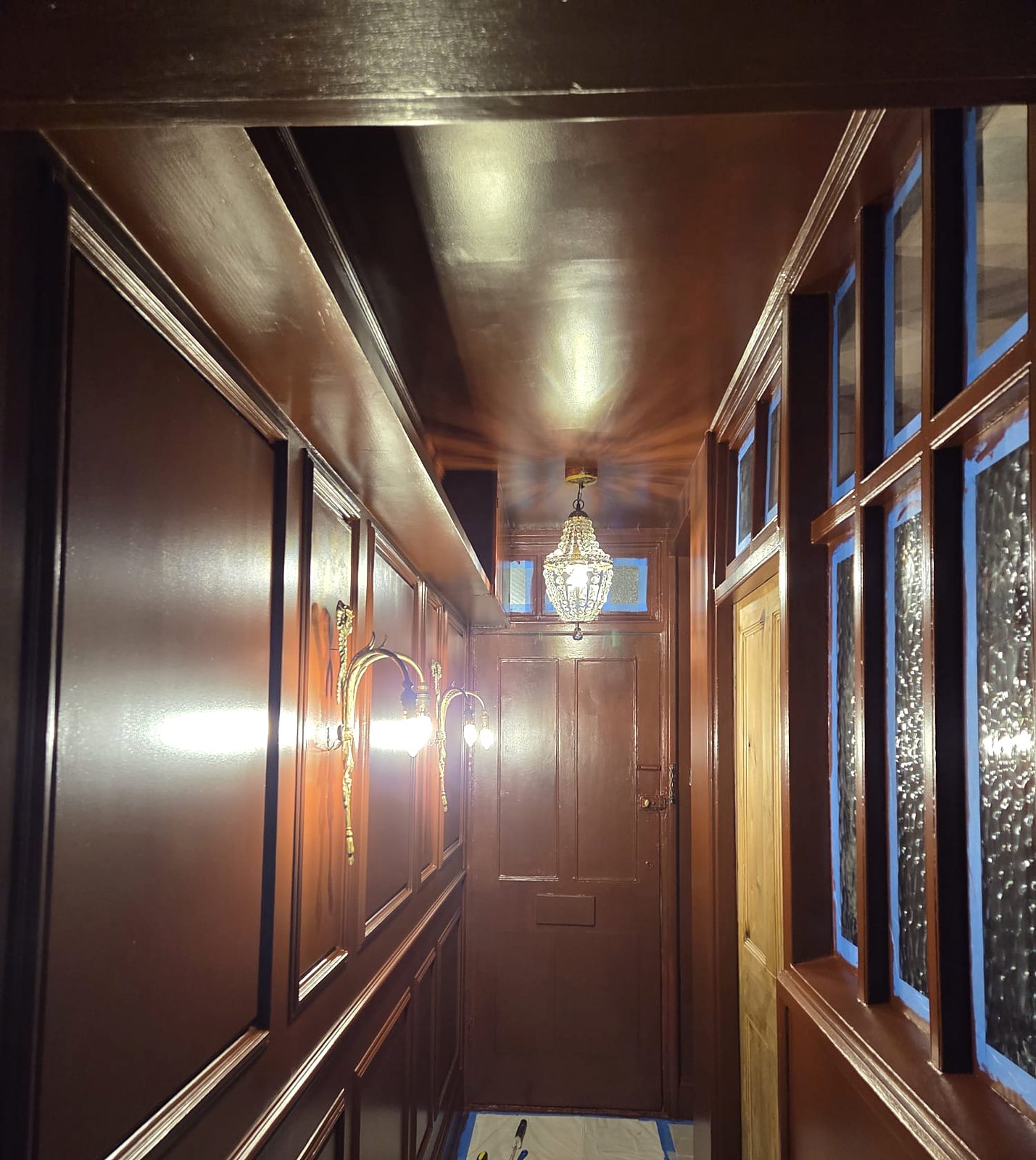 Panelled hallway in rich brown gloss, painted by Zakro