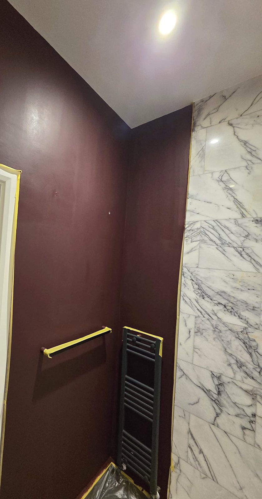 Burgundy bathroom beside marble, painted by Zakro