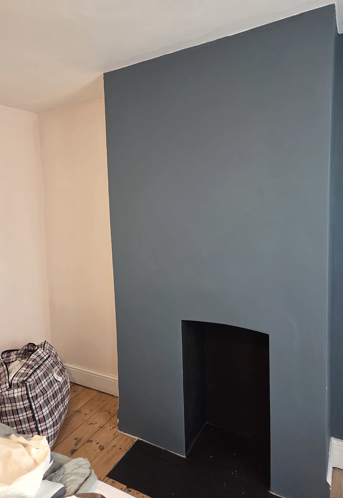 Dark blue chimney breast, painted by Zakro