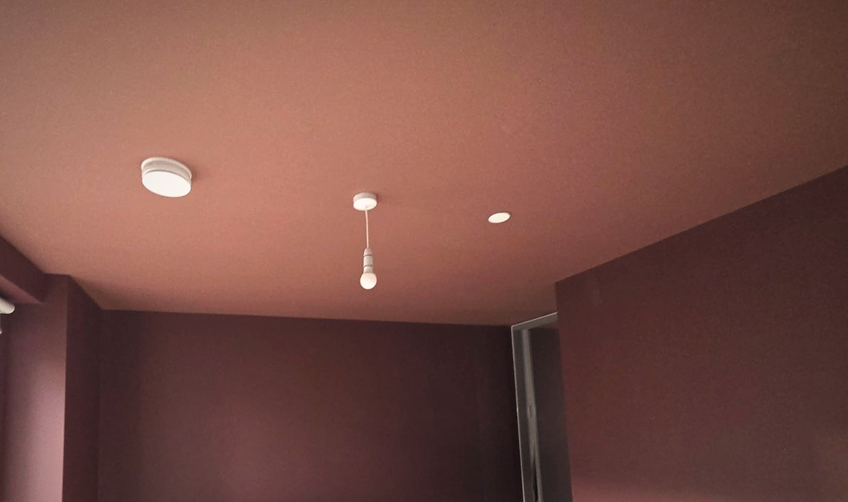 Colour-drenched plum bedroom
