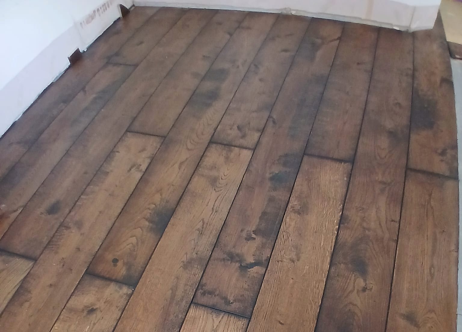 Wide oak plank flooring, painted by Zakro